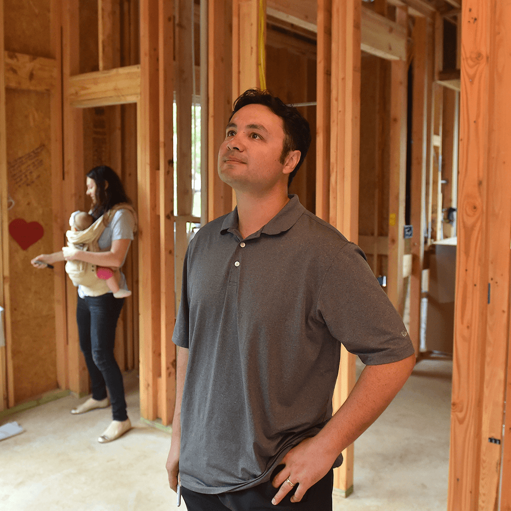 carlton family inside an unfinished home