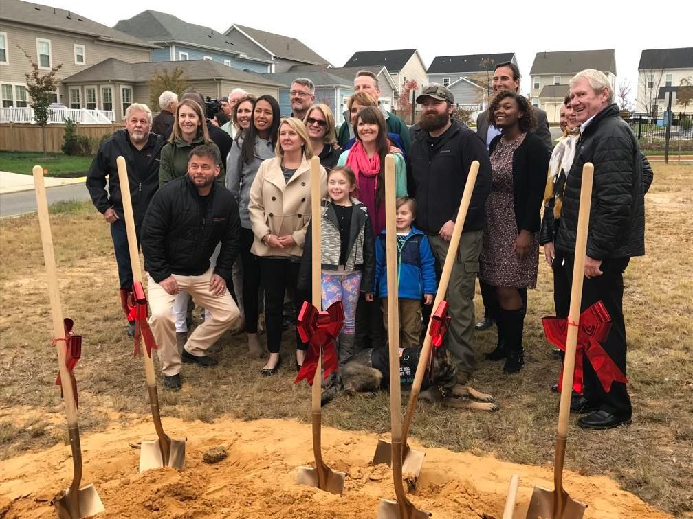 the goodrich family at the groundbreaking of their new home